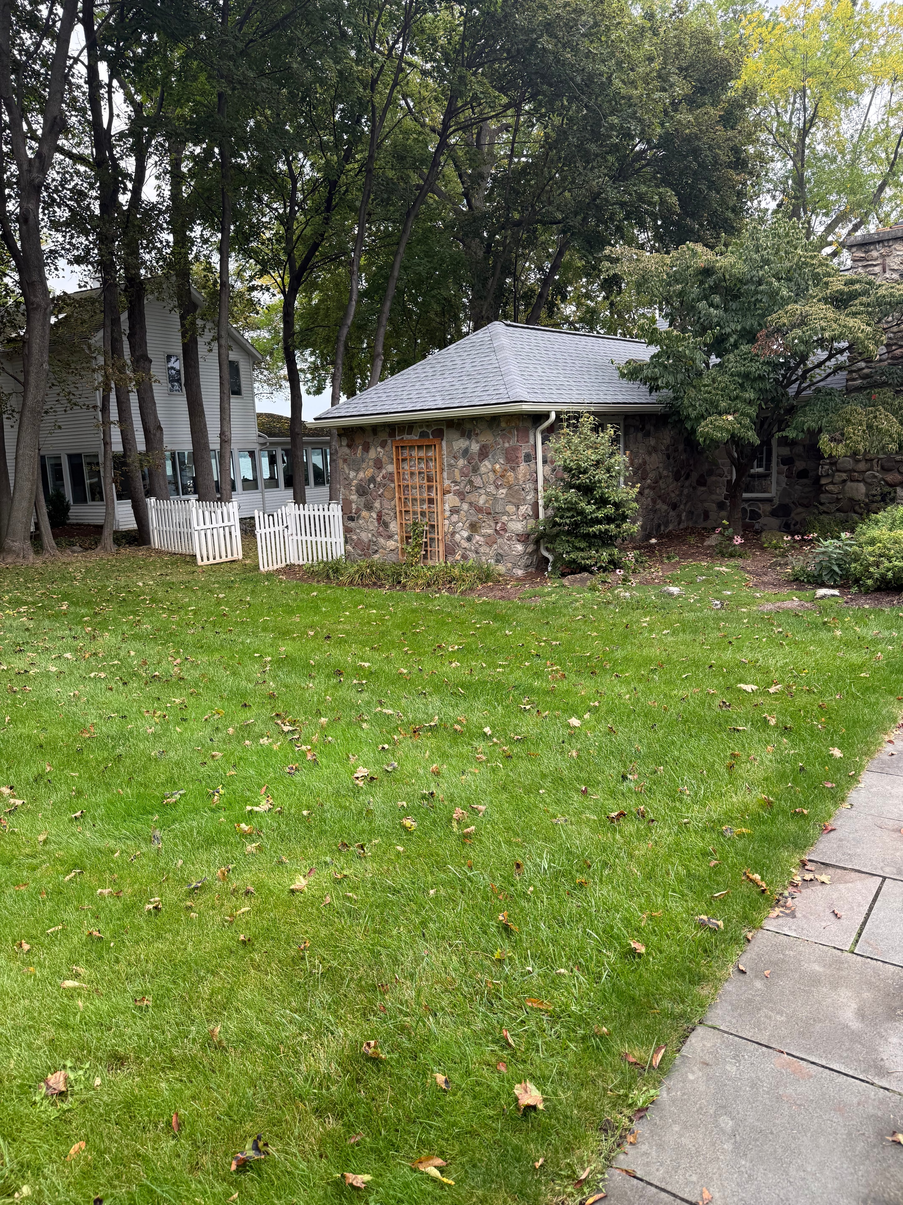Stone cottage, lush lawn care